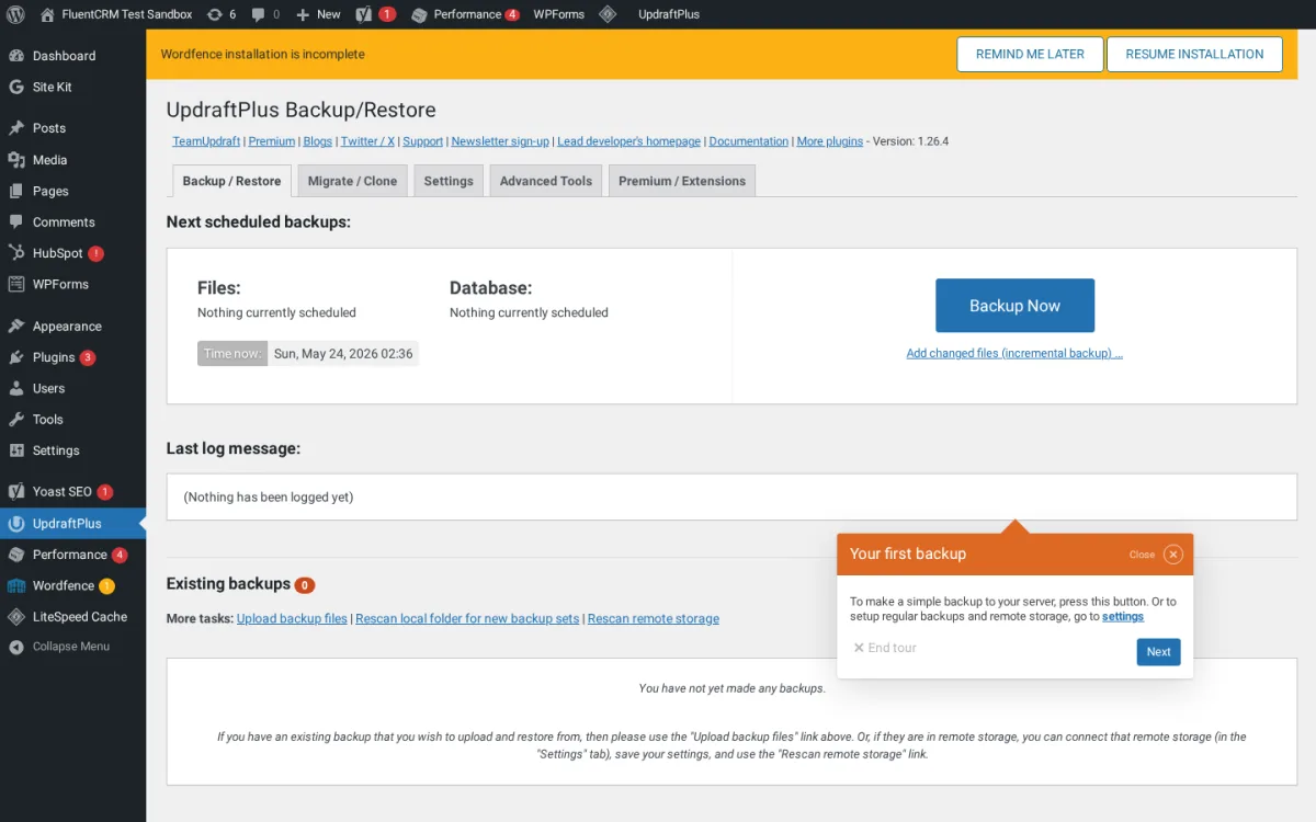 UpdraftPlus Backup/Restore tab in WordPress admin showing the Backup Now button, scheduled backups panel, and Migrate, Settings, and Premium tabs.