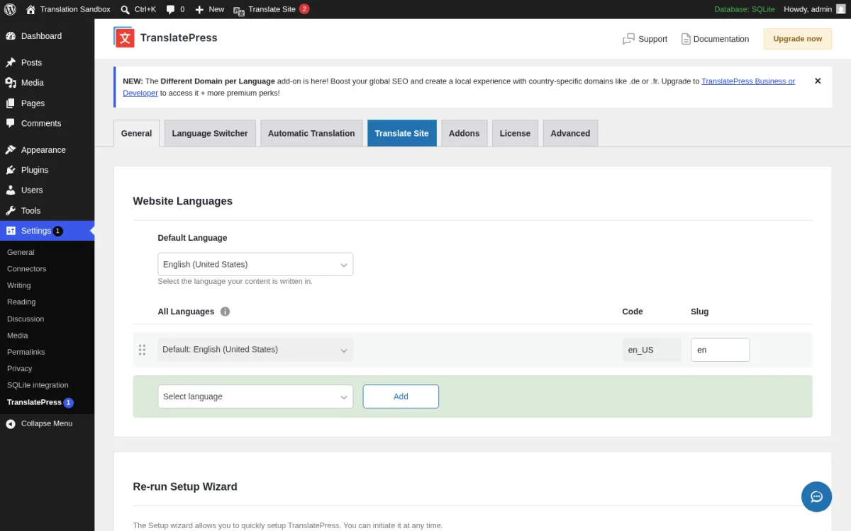 TranslatePress 3.2.1 Settings page inside a real WordPress 7.0 install showing the TranslatePress header with Support, Documentation, and Upgrade now buttons, the Different Domain per Language Business or Developer upsell banner, the seven-tab strip (General, Language Switcher, Automatic Translation, Translate Site selected, Addons, License, Advanced), the Website Languages section, the Default Language drop-down set to English (United States), the All Languages table with the Default English (United States) row plus a Select language Add row, the Re-run Setup Wizard heading at the bottom, the inner Settings submenu (General, Connectors, Writing, Reading, Discussion, Media, Permalinks, Privacy, SQLite integration, TranslatePress), and the floating chat-support icon in the bottom right.