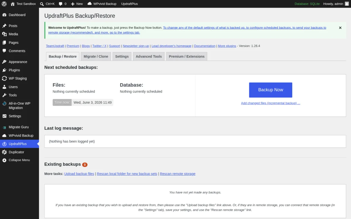 UpdraftPlus Backup and Restore screen inside a real WordPress install showing the Welcome to UpdraftPlus welcome banner, the TeamUpdraft Premium Blogs Twitter Support Newsletter sign-up Lead developer's homepage Documentation More plugins header links, the Backup Restore Migrate Clone Settings Advanced Tools Premium Extensions tab strip with Backup Restore highlighted, the Next scheduled backups Files and Database panels, the blue Backup Now button, the Last log message panel, and the Existing backups empty state with the You have not yet made any backups note